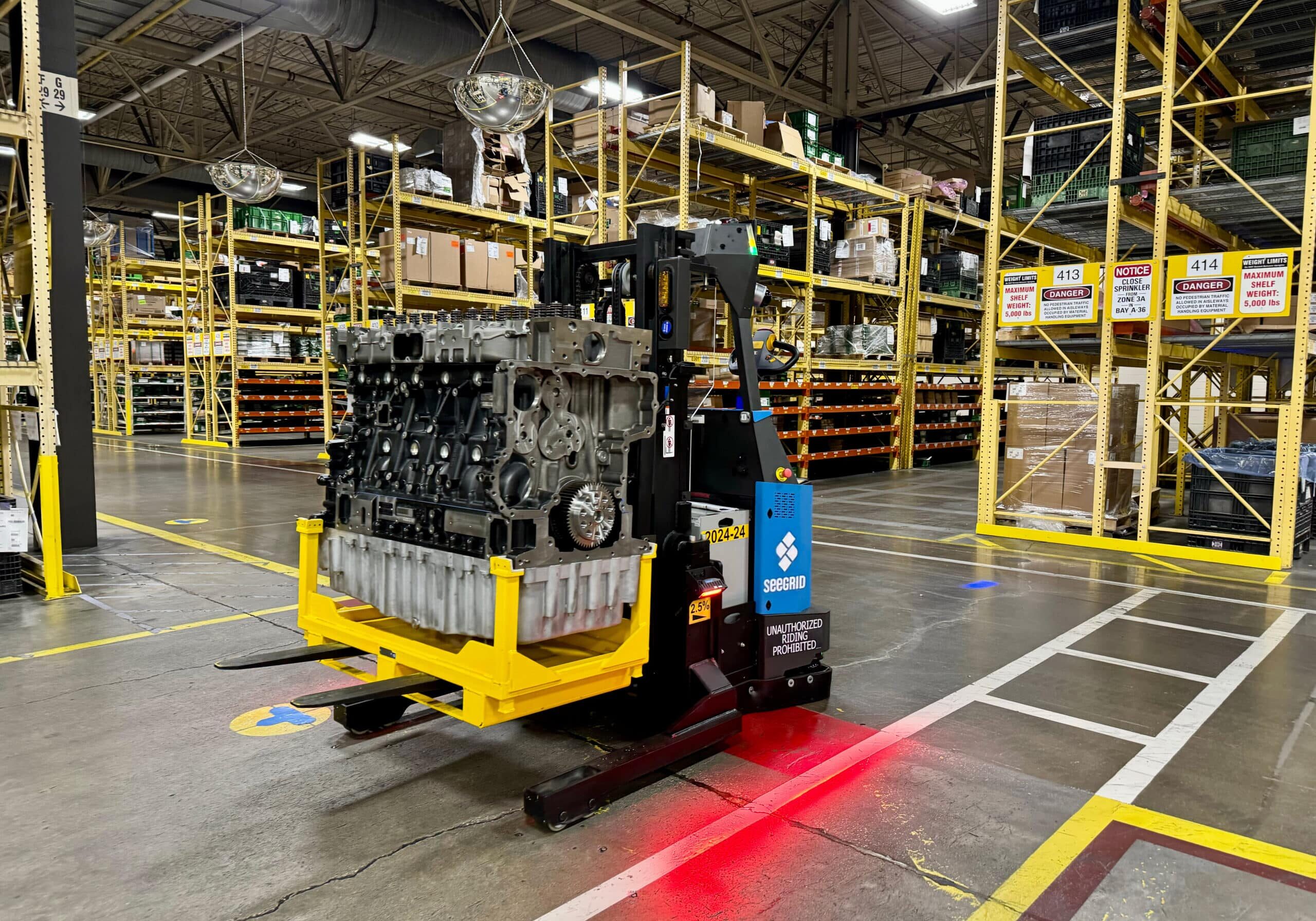 Seegrid Lift RS1 AMR carrying heavy payload in manufacturing facility